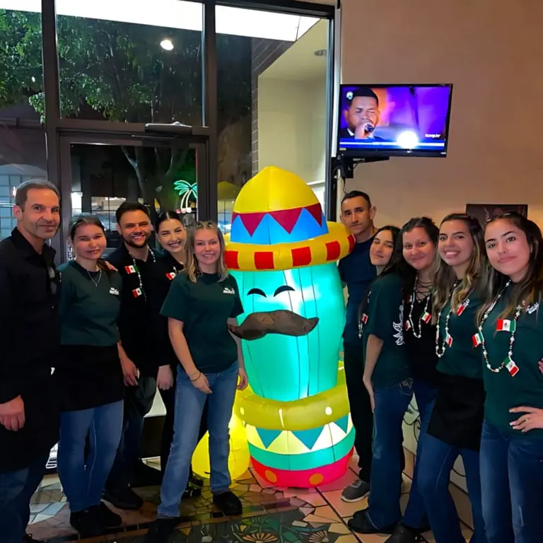 Guests gathering for a celebration at El Jardín